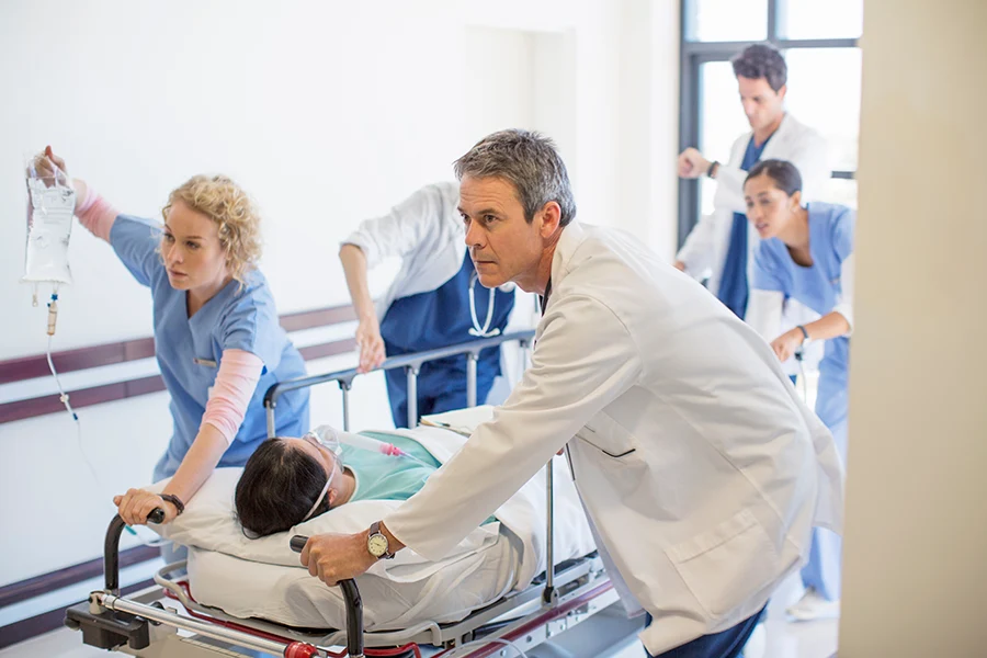 emergency-doctors-patient-care Emergency Room Doctors with Patient