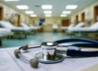 Emergency room department with stethoscope on top of a cashflow leger.