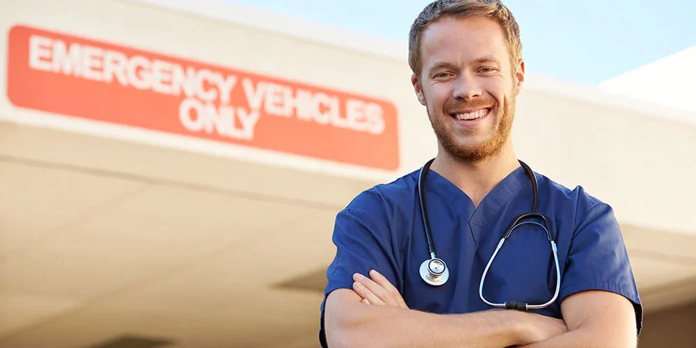 Emergency Room Doctor Standing in Front of Emergency Room