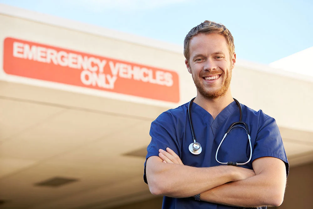 Emergency Room Doctor Standing in Front of Emergency Room