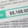 Close-up of a hospital bill showing a large payment due, representing challenges in managing patient balances for emergency and urgent care facilities.
