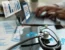 Healthcare professional analyzing billing metrics and charts on a laptop with digital overlays, symbolizing KPI tracking in emergency and urgent care billing.