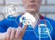 Doctor using digital icons for automation and data integration, illustrating billing technology upgrades for emergency and urgent care practices.