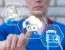 Doctor using digital icons for automation and data integration, illustrating billing technology upgrades for emergency and urgent care practices.