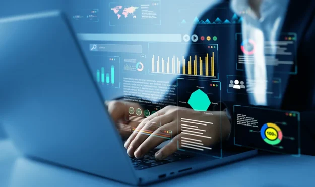Custom medical billing reporting dashboard on laptop showing denial trends and revenue metrics for ER and urgent care.